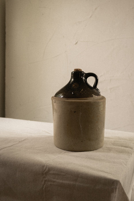 Antique stoneware whiskey jug vessel