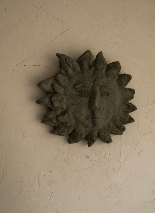 Vintage abstract stone sun face wall decor