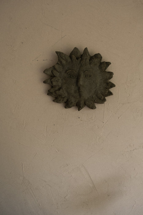 Vintage abstract stone sun face wall decor