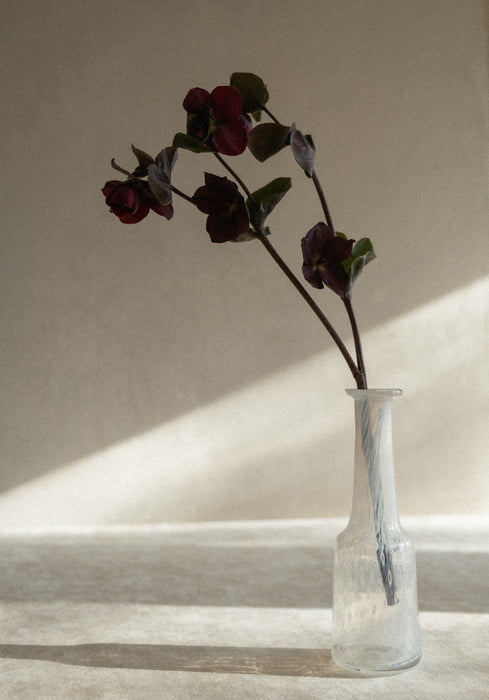 Vintage blown glass white bud vase by designer Bertil Vallien