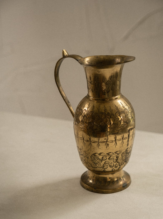Vintage brass vase with floral design