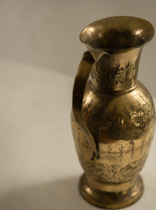 Vintage brass vase with floral design