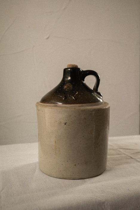 Antique stoneware whiskey jug vessel